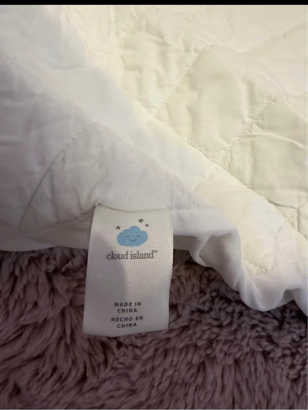Set of standard crib sheets (4)and crib mattress protectors (3)